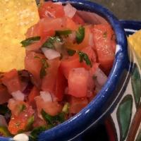 Pico De Gallo W, Tortilla Chips (1) · chopped tomatoes, red onion, serrano chiles and cilantro