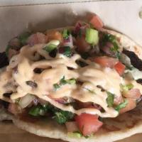 Mexighanoush Black Bean Falafel Taco (1) · This homemade black bean falafel is topped with chipotle mayonnaise,  babaghanoush and pico ...