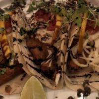 Fish Taco Entrée · Three grilled corn tortillas stuffed with fresh, beer-battered fried bass, our signature cre...