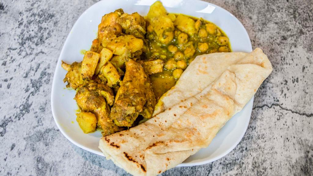 Roti Or Rice & Curry Chicken  · Paratha roti with curry chicken on the side