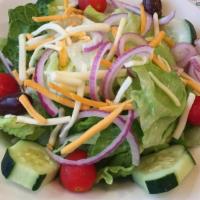 House Salad · Mixed greens, tomato, Cucumber, carrots, peppers, and onions.