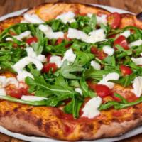Caprese Pizza · Fiammante San Marzano DOP tomato sauce, buffalo mozzarella DOP, arugula, cherry tomatoes, EVOO