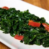 Spinaci Saltati · Sautéed spinach in garlic and extra virgin olive oil