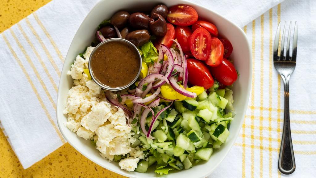 Greek Salad · Romaine lettuce, feta, calamata olives, banana peppers, red onion, cucumber grape tomatoes with balsamic vinaigrette.