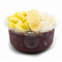 Tropical- Acai Bowl* · Pure acai topped with granola, banana, pineapple, coconut flakes, and honey. Acai bowl blend...