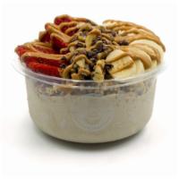 Nica Bowl · Banana blend topped with granola, banana, cacao nibs, walnuts, strawberry, and peanut butter...