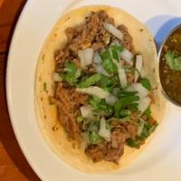 Barbacoa Tacos · Tacos served with soft onion and cilantro. Served with pico de gallo, lettuce, and cheese on...