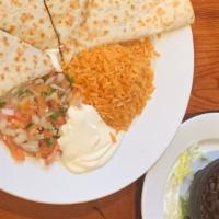 Chorizo Quesadillas · Fresh flour  quesadilla, pan seared crusted shrimp,kale, sauteed vegetables, rice and black ...