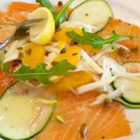 Salmone Contadina · Broiled salmon over sautéed fresh vegetables, prune reduction sauce.