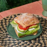 Avocado Mozzarella Sandwich · Avocado, Fresh Mozzarella, Tomato, Lettuce.