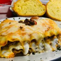 Large  Meat Lasagna - Ground Beef  (Approx 2 Servings) · Ground beef. Include 2 units Garlic  Bread.