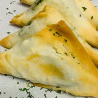 Spanakopita 6 Units · 4 units. Crispy baked phyllo wrapped in flaky phyllo dough stuffed with spinach and a blend ...