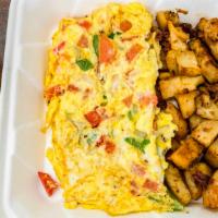 Spanish Omelette · Three (3) farm fresh eggs, peppers, onions, and pepper jack cheese smothered with a mellow s...
