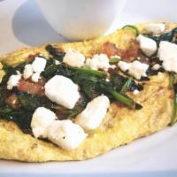 Greek Omelette · Three (3) farm fresh eggs, fresh spinach, and feta cheese.