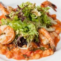 Tuscan Shrimp Salad · Grilled shrimp, white beans, chopped tomatoes, roasted garlic and mixed greens with our lemo...