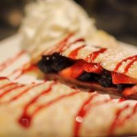 Wild Berry Crepe · Fresh blueberries, strawberries, and raspberry sauce.