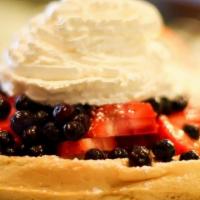 Berries And Cream Waffle · Fresh strawberries, blueberries, raspberry sauce, and whipped cream. Served with syrup. Not ...