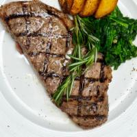 Bistecca · 16oz. Ny strip steak with garlic butter & rosemary served with broccoli rabe.