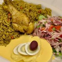 Arroz Con Pollo · Chicken with green rice.