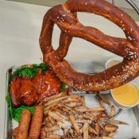 Burger Bar App Sampler · Bavarian jumbo pretzel, mozzarella sticks, buffalo wings & truffled parmesan fries.