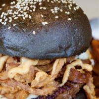 Black N Blue Bacon Burger · 1/2 lb blackened burger topped with crumbled blue cheese, crispy onions, Applewood smoked ba...
