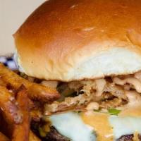 South Of The Border Burger · 1/2 lb burger topped with pepper jack, pickled jalapenos, crispy onions & chipotle aioli on ...