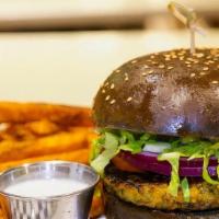 Black Bean & Corn Veggie Burger · 7 oz. Black Bean & Corn veggie burger topped with lettuce, tomato & onion on a brioche bun s...