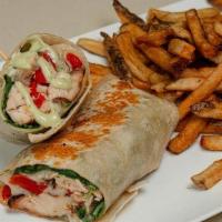 Tuscan Grilled Chicken Wrap · Grilled chicken with roasted peppers, mozzarella, arugula, basil aioli wrapped in a warm tor...