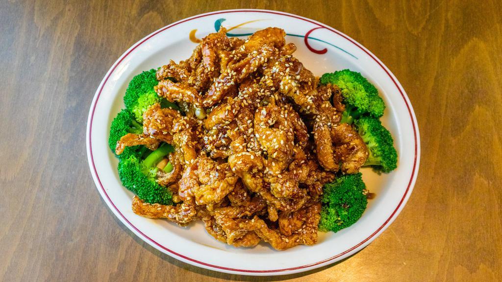 Sesame Chicken · Crispy chicken strip, sweet, and tangy sauce coated with sesame seeds. Served with white rice. Spicy.