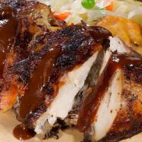 Jerk Chicken · Meals are served with a side of steamed vegetables, fried plantains, a choice of plain rice ...