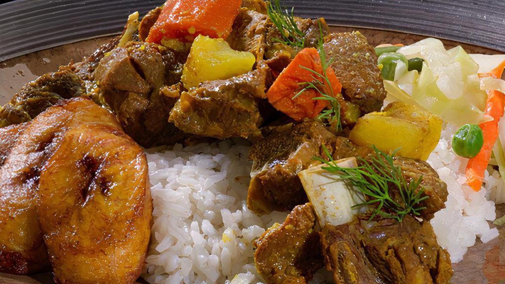 Curried Goat · 1127-1455 Calories.Goat meat marinated in curry & other Caribbean spices.