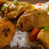 Curried Chicken · Curry drenched chicken on the bone. Served with rice and peas or white rice, and steamed veg...