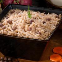 Rice & Peas · Aromatic traditional Jamaican side dish. Seasoned with thyme, garlic, and a blend of spices