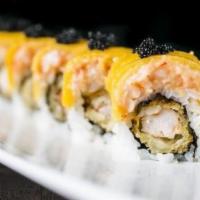 Volcano Roll · Spicy. Shrimp tempura with spicy mayo, topped with mango, lobster salad and black tobiko.