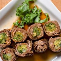 Beef Negimaki Appetizer · Sliced beef rolled with scallion.