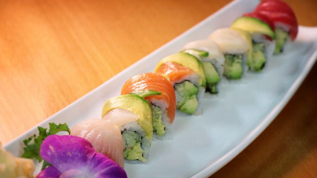 Rainbow Roll · Eight pieces of california roll and cucumber wrapped with tuna, salmon, and whitefish.