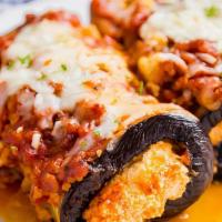 Eggplant Rollatini (3) · fresh rolled eggplant with ricotta, topped with marinara sauce and melted mozzarella