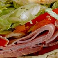 Italian Hero · ham, soppressata, salami, provolone, lettuce, tomato, and Italian dressing