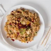Pineapple Fried Rice · Pineapple, cashew nuts, raisins, green peas, carrot, onions, scallions and egg served in a f...