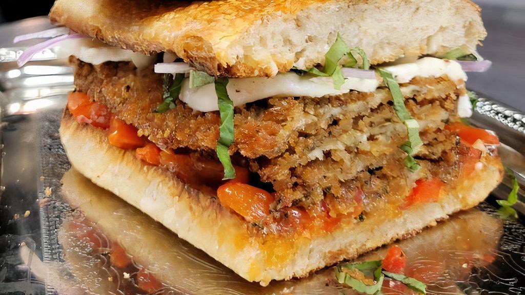 Eggplant & Roasted Red Peppers Sandwich · ~ breaded eggplant, roasted red peppers, fresh garlic, house made fresh mozzarella, red onion, drizzled vinegar & oil on house made bread