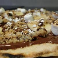 Nutella Pizza · ~ layer of nutella topped w/banana, crumbled chocolate chip cookies, toasted marshmallows & ...