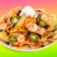 Shrimp Nachos · Melty nachos loaded with shrimp, melted cheese, pico de gallo, black beans, and your choice ...