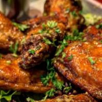 Kafou Wings · Choice Of Kreyol Sauce Or Honey Jerk Sauce