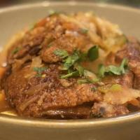 Cana Creole · Roasted half duck, marinated for 2 days in a savory creole sauce