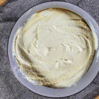 Homemade Hummus · Pureed chickpeas, tahini, garlic and lemon juice. Served with pita bread. Vegan.