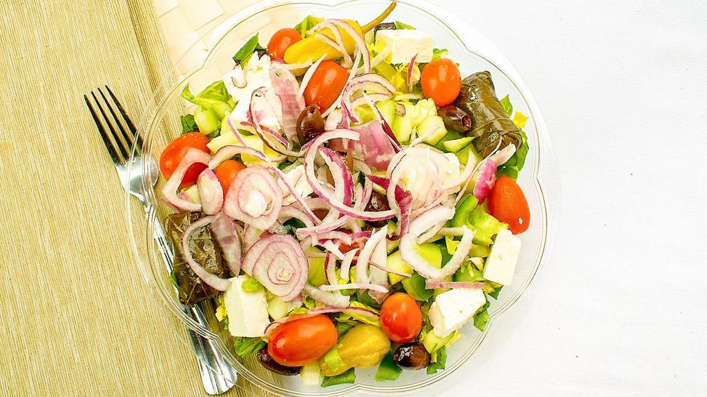 Side Greek Salad · Chopped romaine lettuce feta tomatoes cucumbers bell peppers red onions kalamata olives grape leaves and our vinaigrette. served with pita bread.