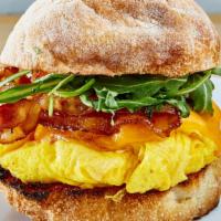 Breakfast Sandwich · Soft scramble eggs, country bacon, cheddar cheese and arugula on balthazar ciabatta roll.
