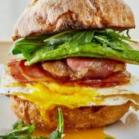 Breakfast Sandwich · Two eggs over easy, provolone cheese, pancetta, avocado and arugula on balthazar ciabatta ro...