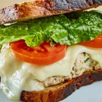 Tuna Melt · House-made tuna salad with melted american cheese, artisan butter lettuce and tomatoes on ba...