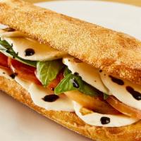 Caprese Panini Sandwich · Fresh mozzarella cheese, basil, tomatoes and balsamic glaze on balthazar semolina flatbread.